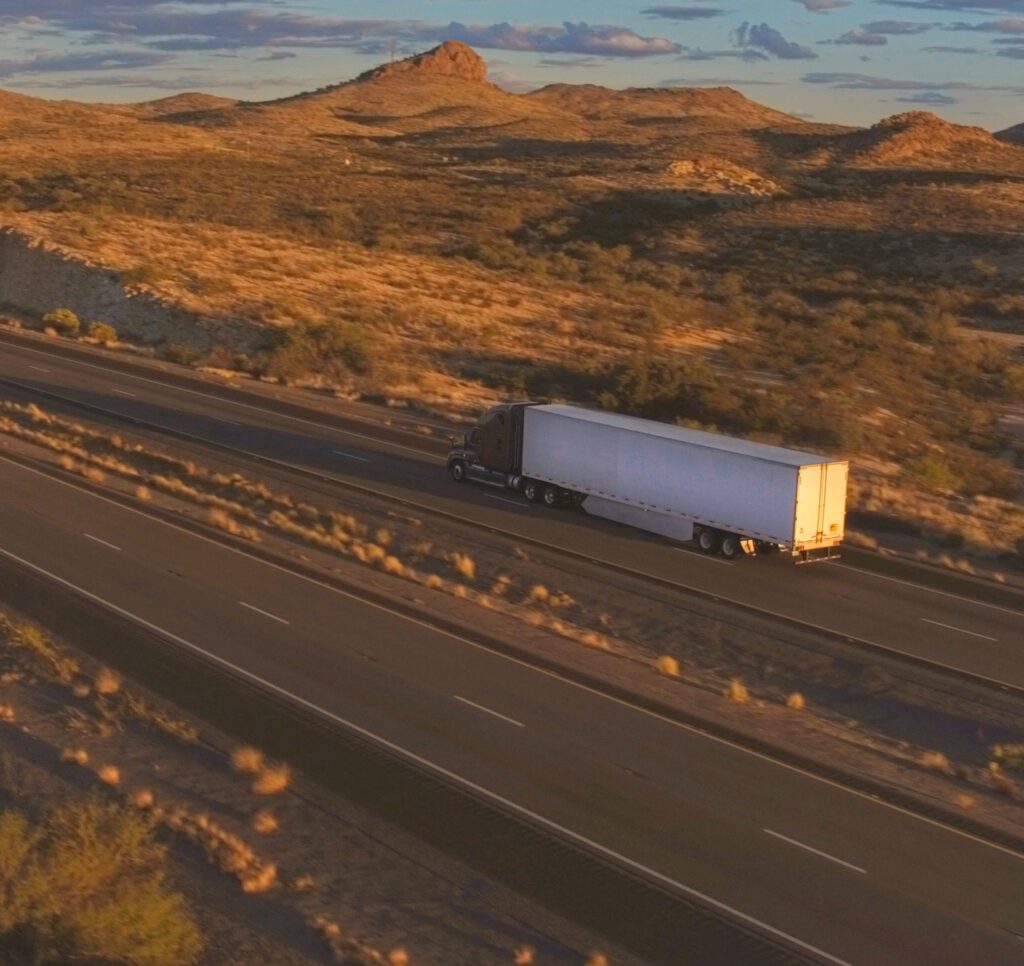 Semi truck driving through desert